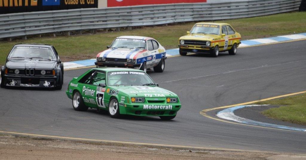 Mustang on track with other vintage cars